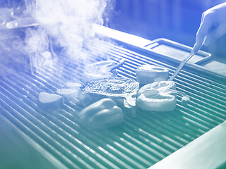 Image showing chef cooking steak with vegetables on a barbecue