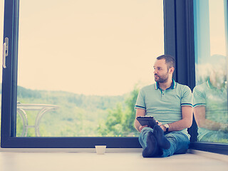 Image showing man on the floor enjoying relaxing lifestyle