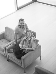 Image showing couple relaxing at  home with tablet computers