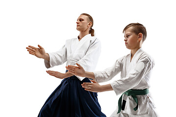 Image showing Man and teen boy fighting at aikido training in martial arts school