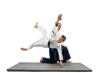 Image showing Man and teen boy fighting at aikido training in martial arts school