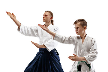 Image showing Man and teen boy fighting at aikido training in martial arts school