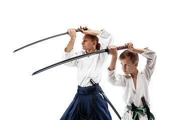 Image showing Man and teen boy fighting at aikido training in martial arts school