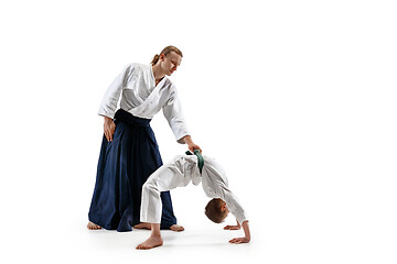 Image showing Man and teen boy fighting at aikido training in martial arts school