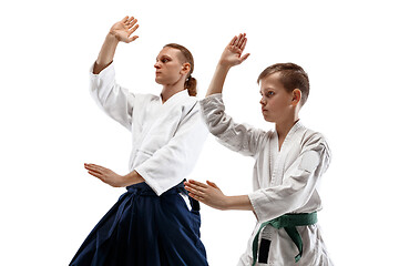 Image showing Man and woman fighting at Aikido training in martial arts school.