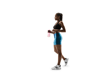 Image showing Young african woman isolated on white studio background.