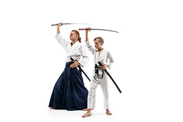 Image showing Man and teen boy fighting at aikido training in martial arts school