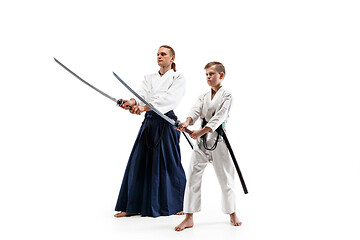 Image showing Man and teen boy fighting at aikido training in martial arts school