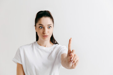 Image showing Woman\'s hand with finger on gray background