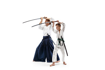 Image showing Man and teen boy fighting at aikido training in martial arts school