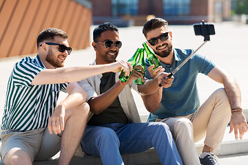 Image showing men toasting beer and taking selfie by smartphone