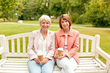 Image showing senior women or friends drinking coffee at park