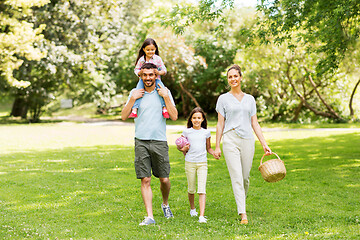 Image showing family with picnic basket walking in summer park