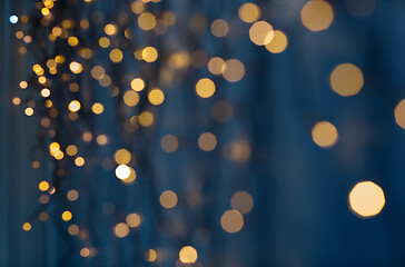 Image showing christmas garland lights over dark blue background