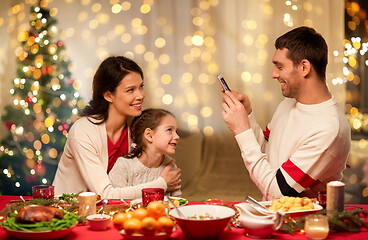 Image showing happy family taking picture at christmas dinner