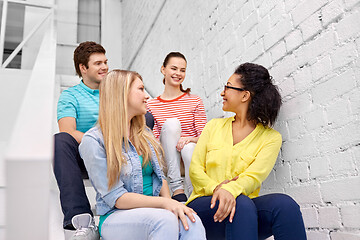 Image showing teenage friends or students hanging out on stairs