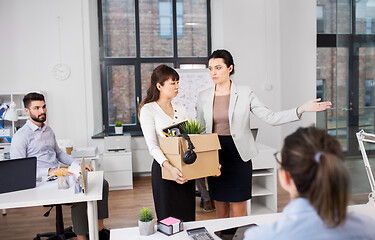 Image showing executive seeing off fired female office worker