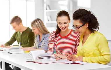 Image showing high school students with books and notebooks