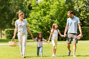 Image showing family with picnic basket walking in summer park