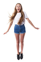 Image showing Full length of happy joyful teen jumping