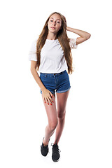 Image showing Full length of casual teen girl posing over white background