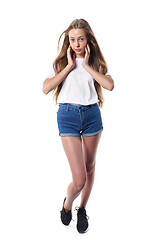 Image showing Full length of casual teen girl posing over white background