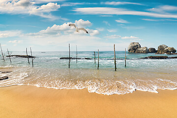 Image showing Beach and fishing poles