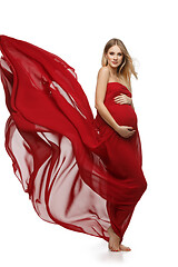 Image showing Pregnant girl in red dress