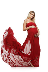 Image showing Pregnant girl in red dress