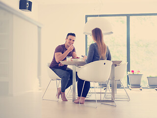 Image showing couple enjoying morning coffee and strawberries