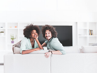 Image showing young multiethnic couple in living room