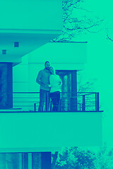 Image showing couple enjoying morning coffee on balcony