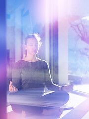 Image showing young woman doing morning yoga exercises