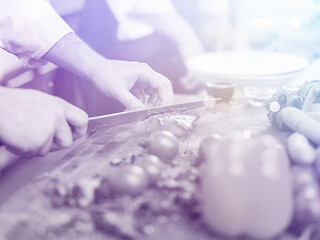 Image showing Chef hands preparing marinated Salmon fish