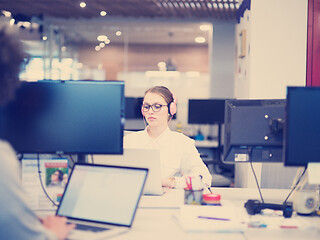 Image showing businesswoman using a laptop in startup office