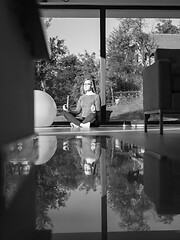 Image showing young woman doing morning yoga exercises