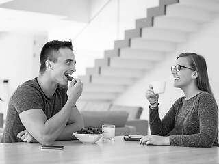 Image showing couple enjoying morning coffee and strawberries