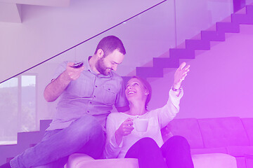 Image showing romantic couple on the sofa watching television