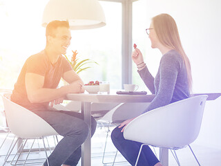 Image showing couple enjoying morning coffee and strawberries