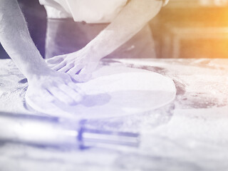 Image showing chef preparing dough for pizza