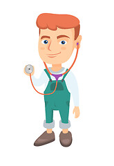 Image showing Caucasian boy in doctor coat holding a stethoscope