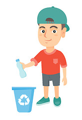 Image showing Boy throwing plastic bottle in recycle bin.