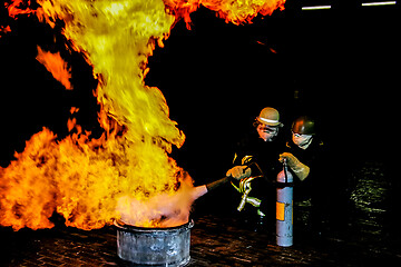 Image showing Firefighters training for fire fighting.