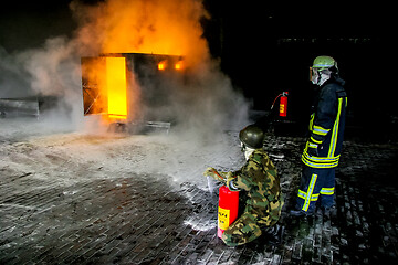 Image showing Firefighters training for fire fighting.