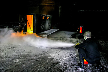 Image showing Firefighters training for fire fighting.