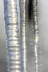 Image showing Roof with icicles hanging from roof.