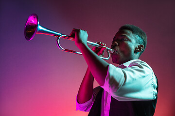 Image showing African American jazz musician playing trumpet.