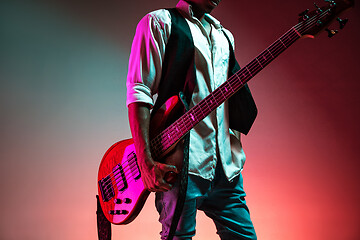 Image showing African American jazz musician holding bass guitar.