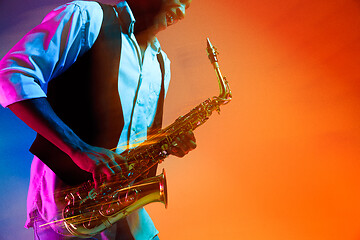 Image showing African American jazz musician playing the saxophone.