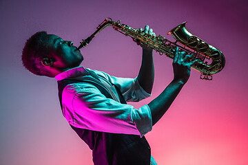 Image showing African American jazz musician playing the saxophone.